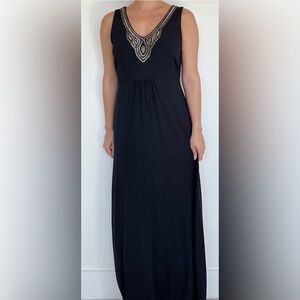 Ptp 17” stretches to 20”. Length 57”. This black stunning Tommy Maxi dress